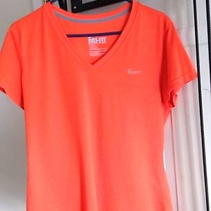 Large Nike t-shirt shirt. Dri Fit. orange tshirt. No tags. Never worn.
